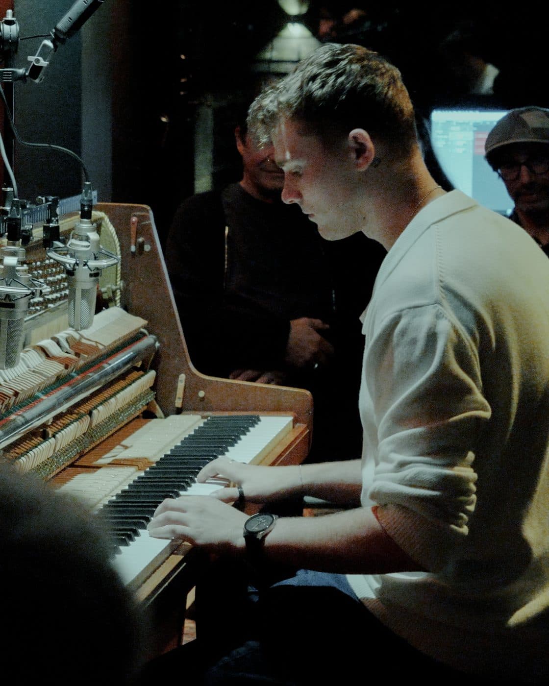 An artist at the opened, miked upright piano during a session in the Amsterdam studio