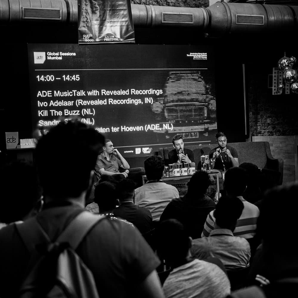 The programme screen for an ADE MusicTalk panel at Amsterdam Dance Event, listing Ivo Adelaar of Revealed Recordings